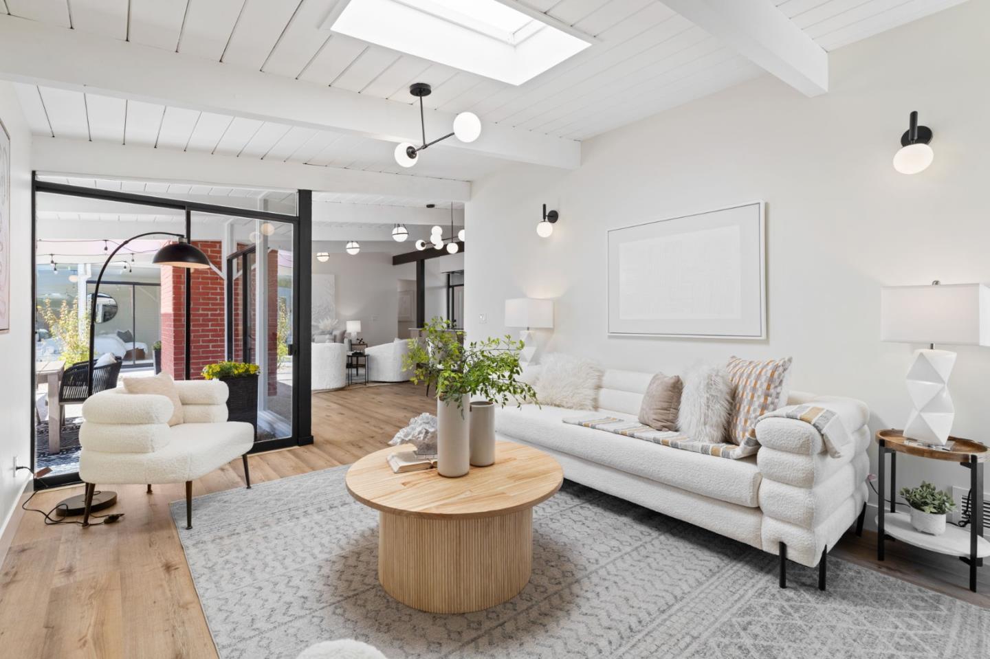1734 Wolfe Drive San Mateo, CA 94402 - Photo 19 of 43 a living room with furniture and a chandelier
