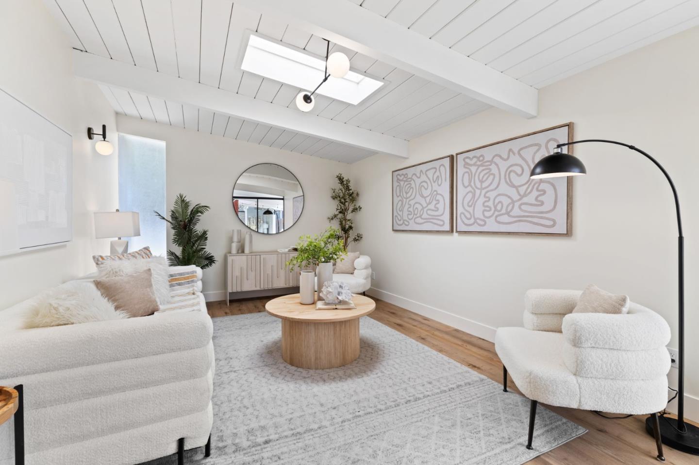 1734 Wolfe Drive San Mateo, CA 94402 - Photo 21 of 43 a living room with furniture a rug and a mirror