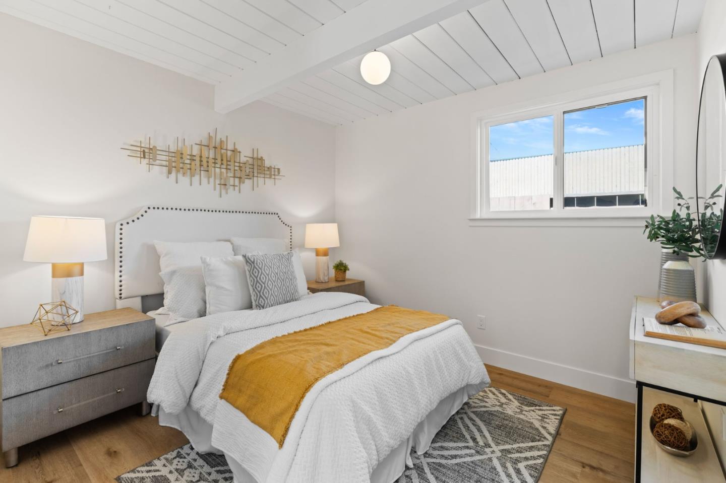 1734 Wolfe Drive San Mateo, CA 94402 - Photo 23 of 43 a bedroom with a bed and a potted plant on the dresser