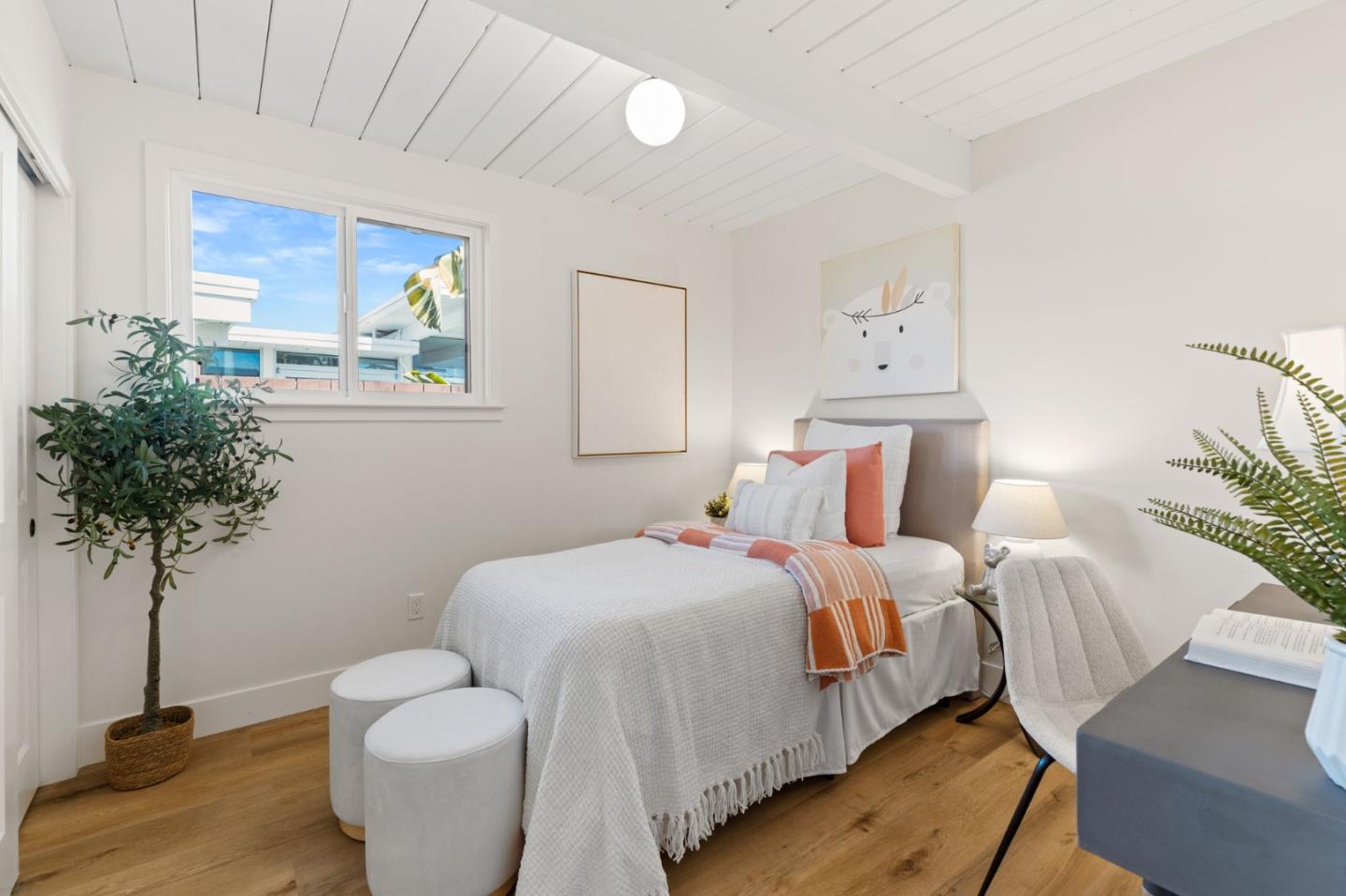 1734 Wolfe Drive San Mateo, CA 94402 - Photo 24 of 43 a bedroom with bed and a potted plant