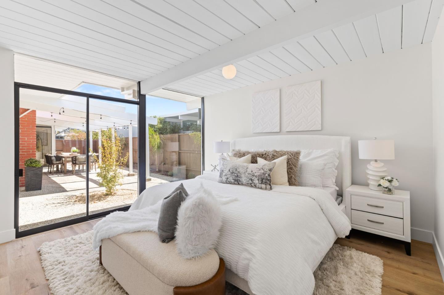 1734 Wolfe Drive San Mateo, CA 94402 - Photo 27 of 43 a bedroom with bed and glass door