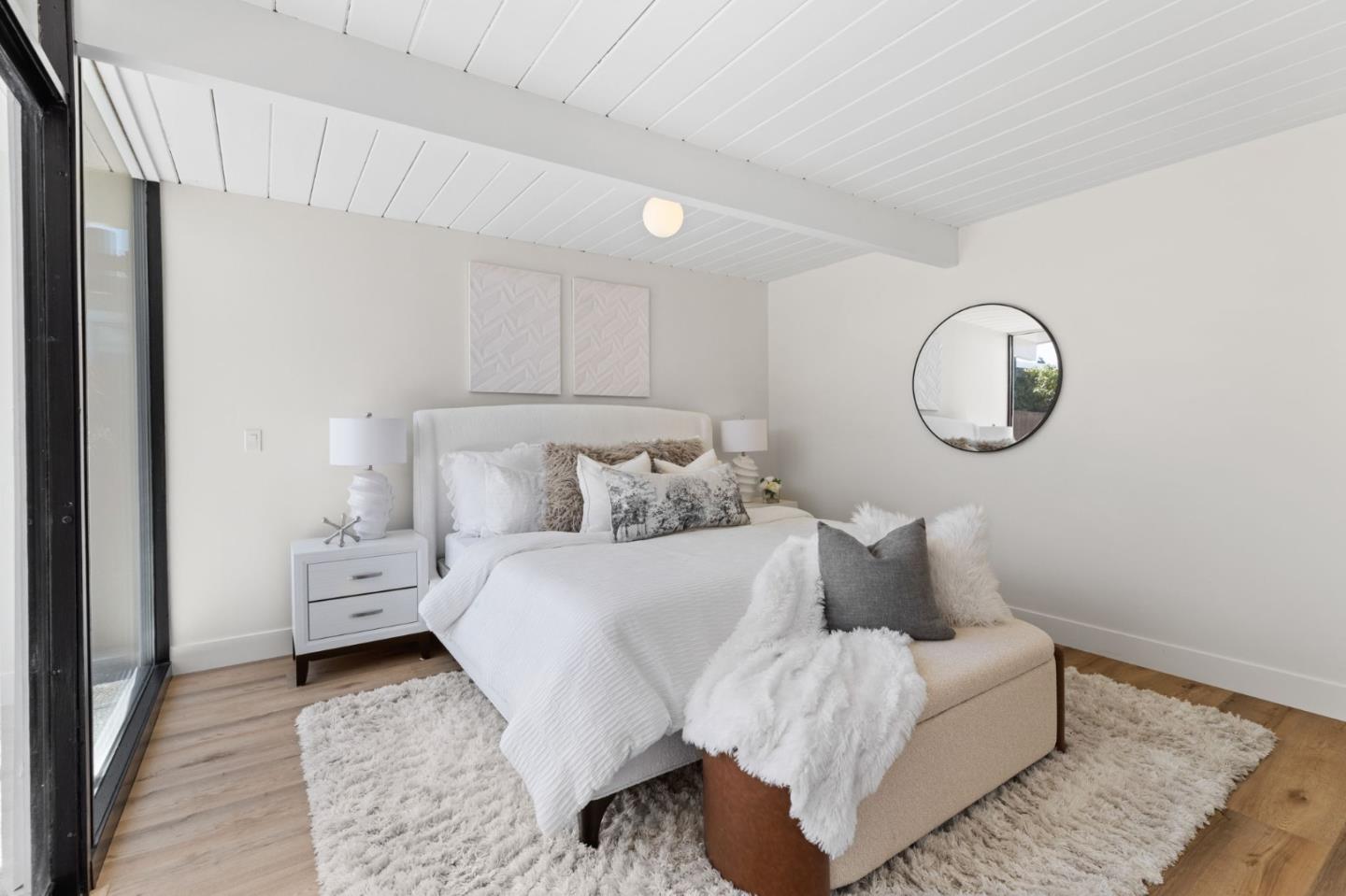 1734 Wolfe Drive San Mateo, CA 94402 - Photo 28 of 43 a large white bed in a white room