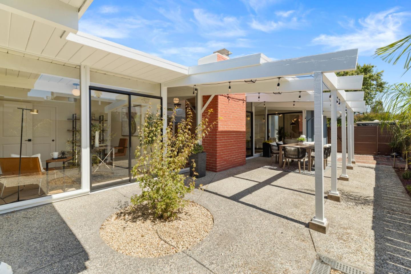 1734 Wolfe Drive San Mateo, CA 94402 - Photo 32 of 43 a view of a patio with table and chairs potted plants