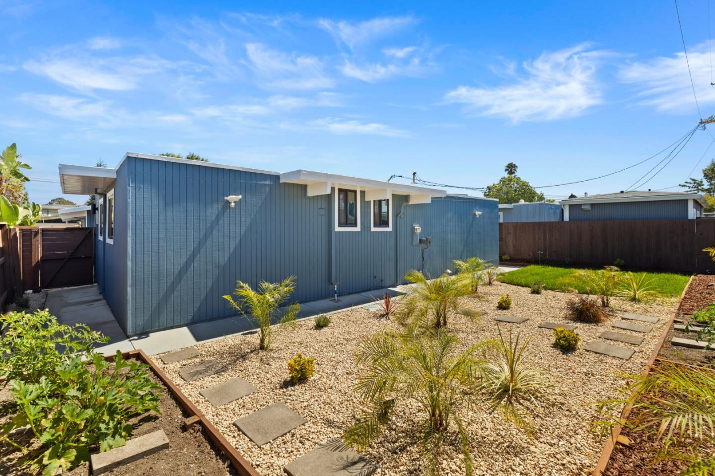 1734 Wolfe Drive San Mateo, CA 94402 - Photo 34 of 43 a backyard of a house with wooden fence