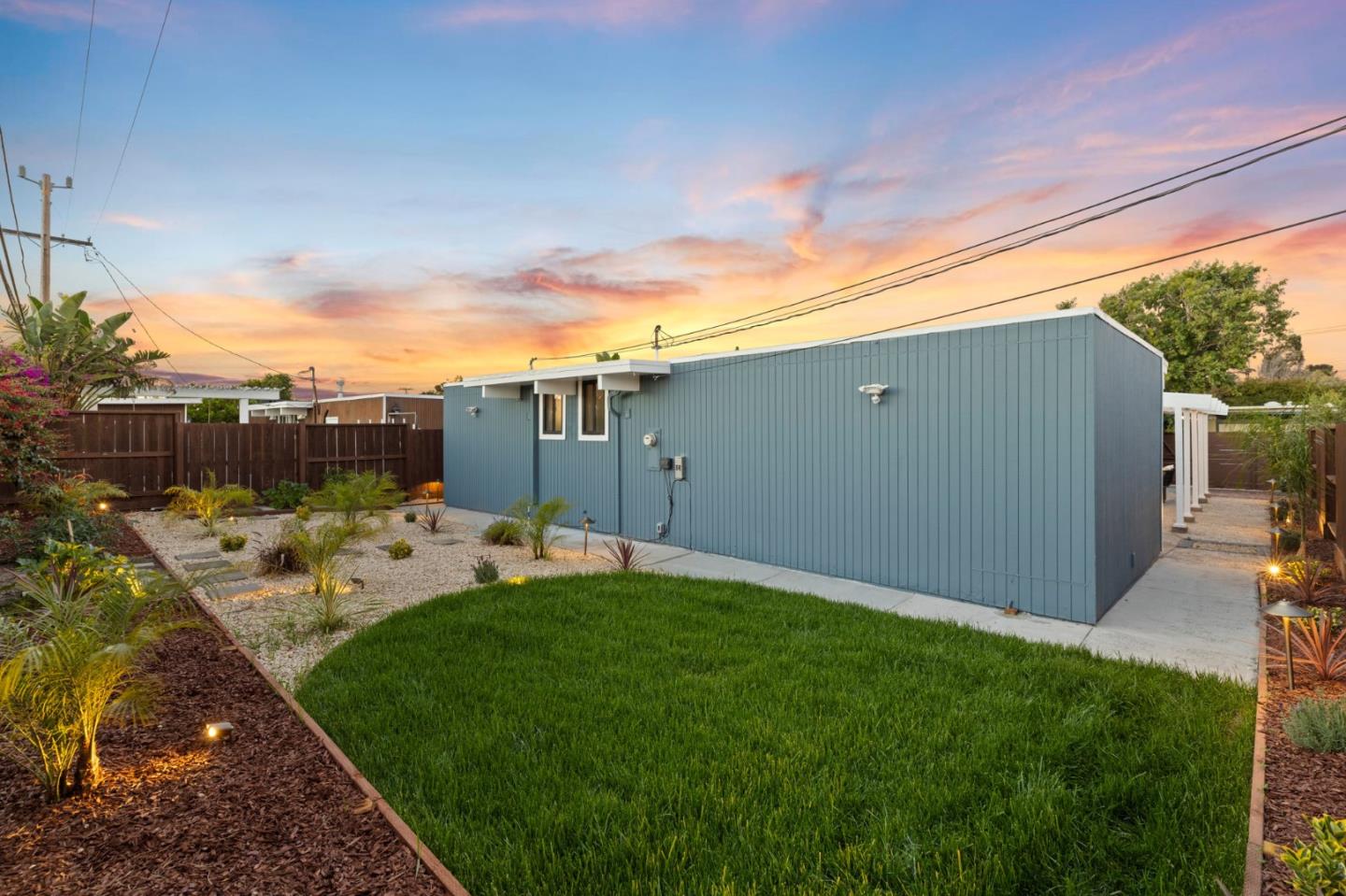 1734 Wolfe Drive San Mateo, CA 94402 - Photo 43 of 43 a view of a backyard with couches plants and large trees