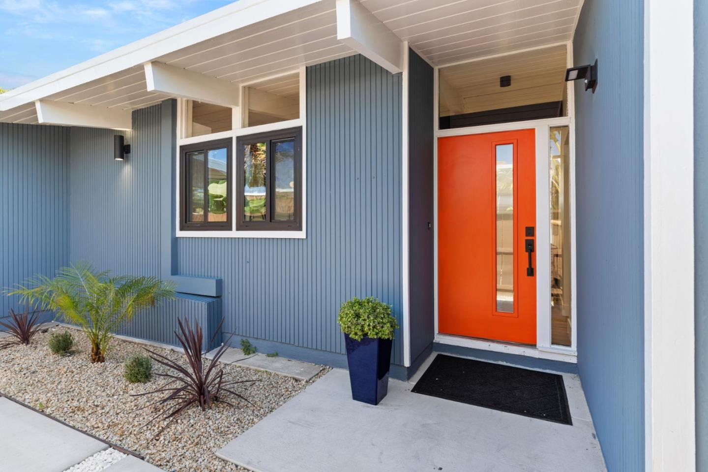 1734 Wolfe Drive San Mateo, CA 94402 - Photo 5 of 43 a potted plant sitting in front of a door