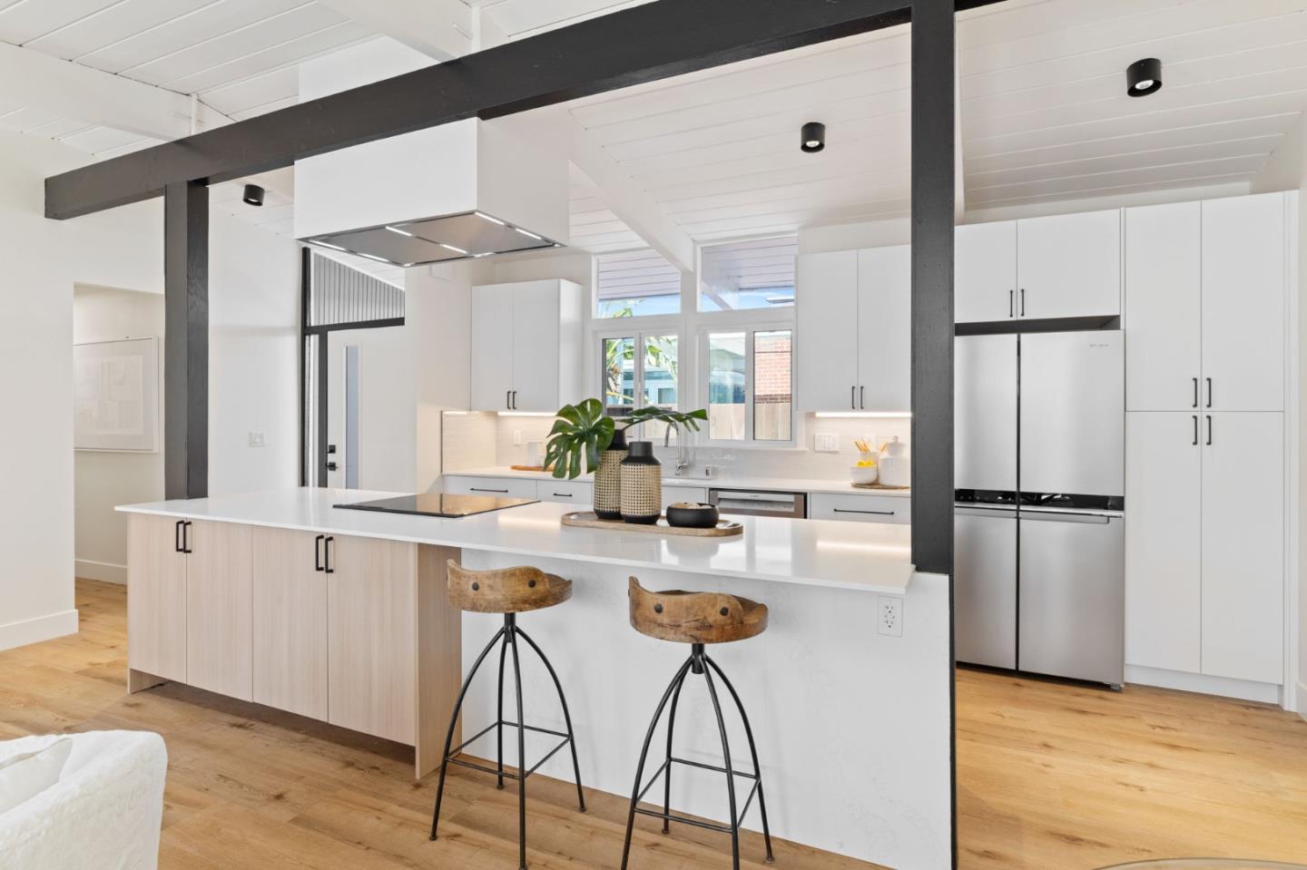 1734 Wolfe Drive San Mateo, CA 94402 - Photo 8 of 43 a kitchen with white cabinets and white appliances