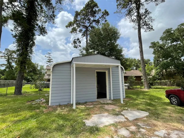 a view of a house with a yard and garage