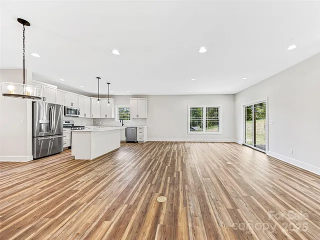 a view of kitchen with wooden floor