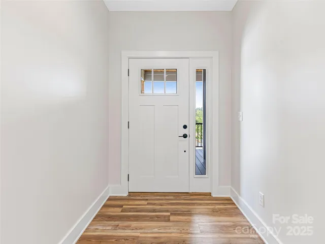 a view of room with window and hardwood floor