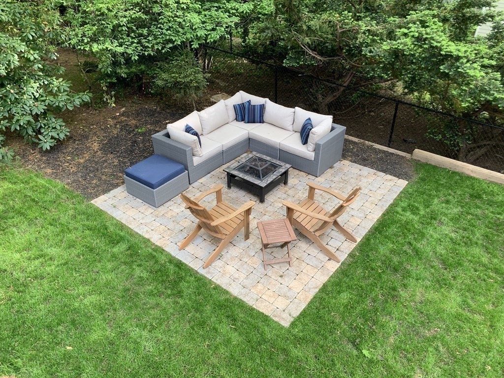 34 Earle Road Wellesley, MA 02481 - Photo 28 of 28 a view of backyard with seating area and green space