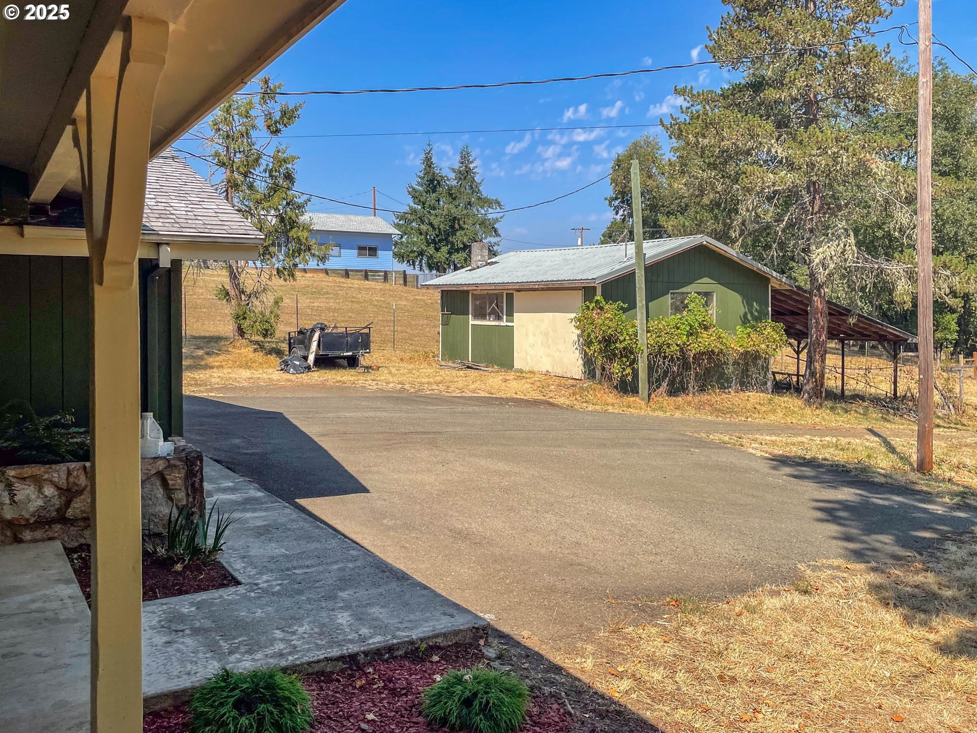 765 O C Brown Road Roseburg, OR 97470 - Photo 2 of 48 a view of a house with a patio