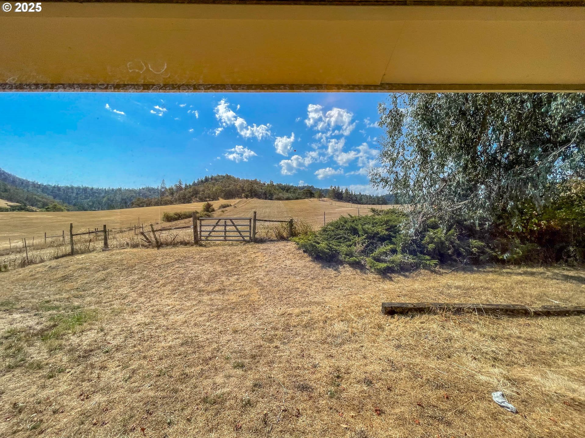 765 O C Brown Road Roseburg, OR 97470 - Photo 21 of 48 a view of a room with a yard and mountain view