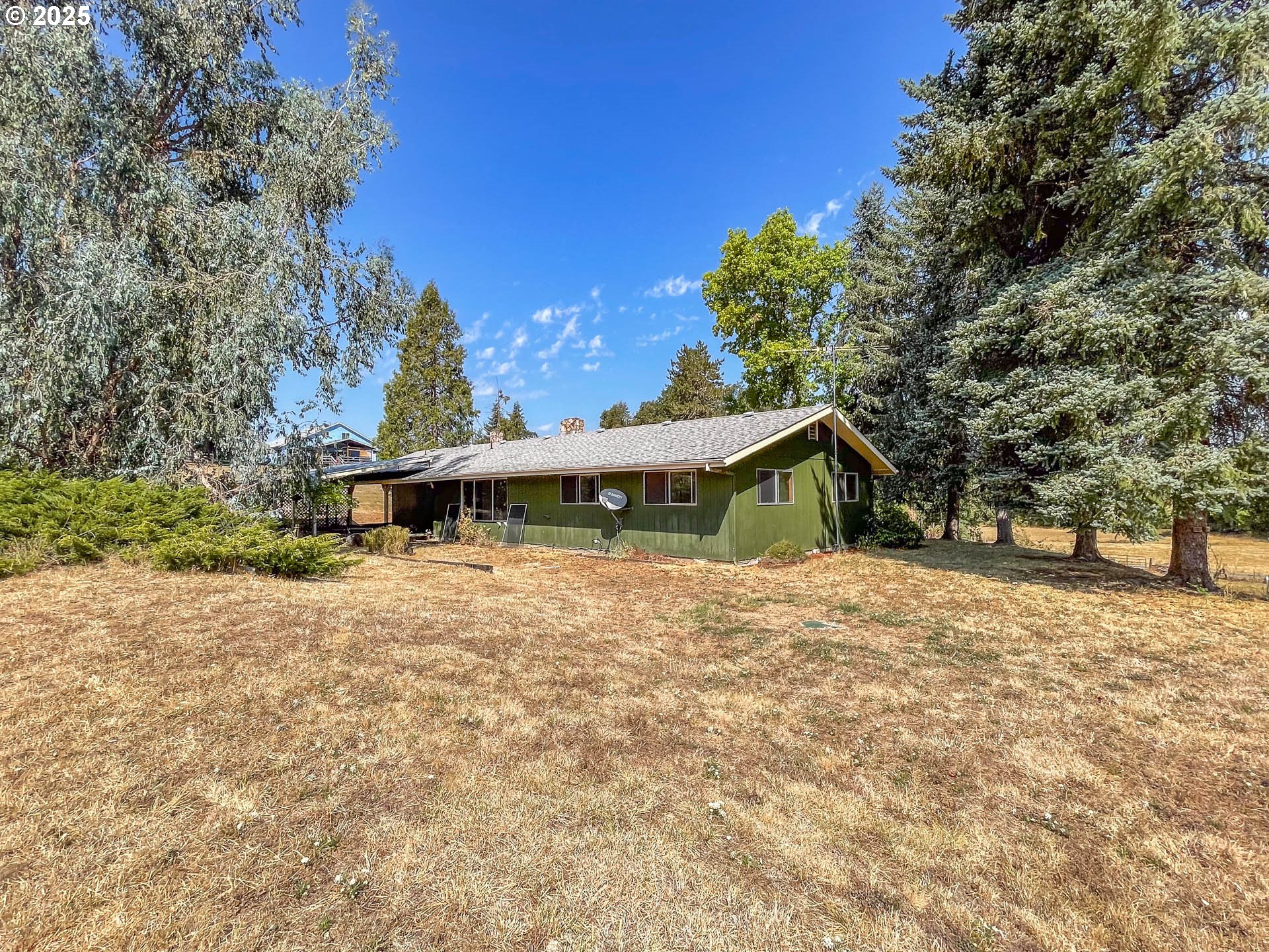 765 O C Brown Road Roseburg, OR 97470 - Photo 40 of 48 a house with trees in the background