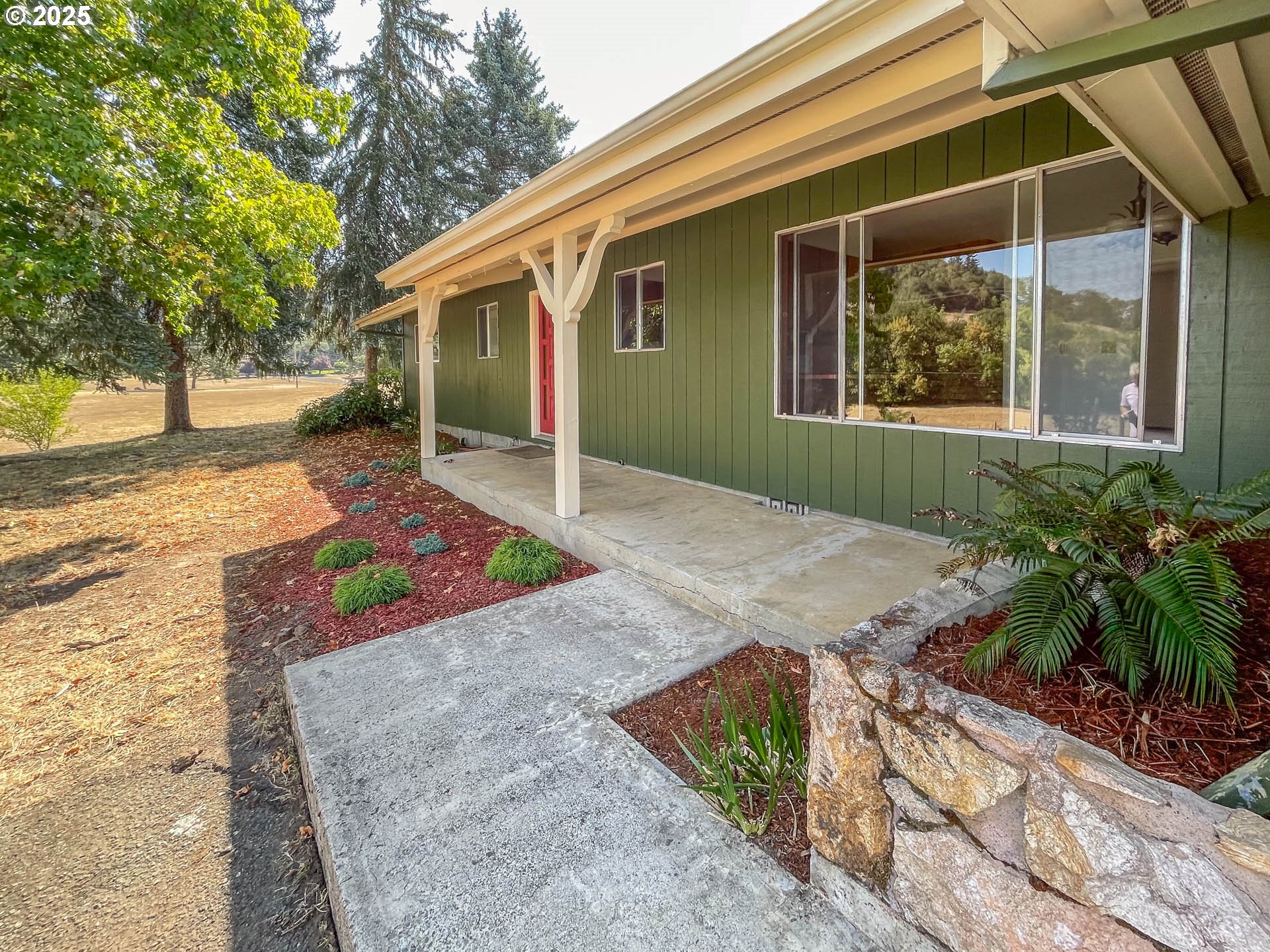 765 O C Brown Road Roseburg, OR 97470 - Photo 4 of 48 a front view of a house with garden