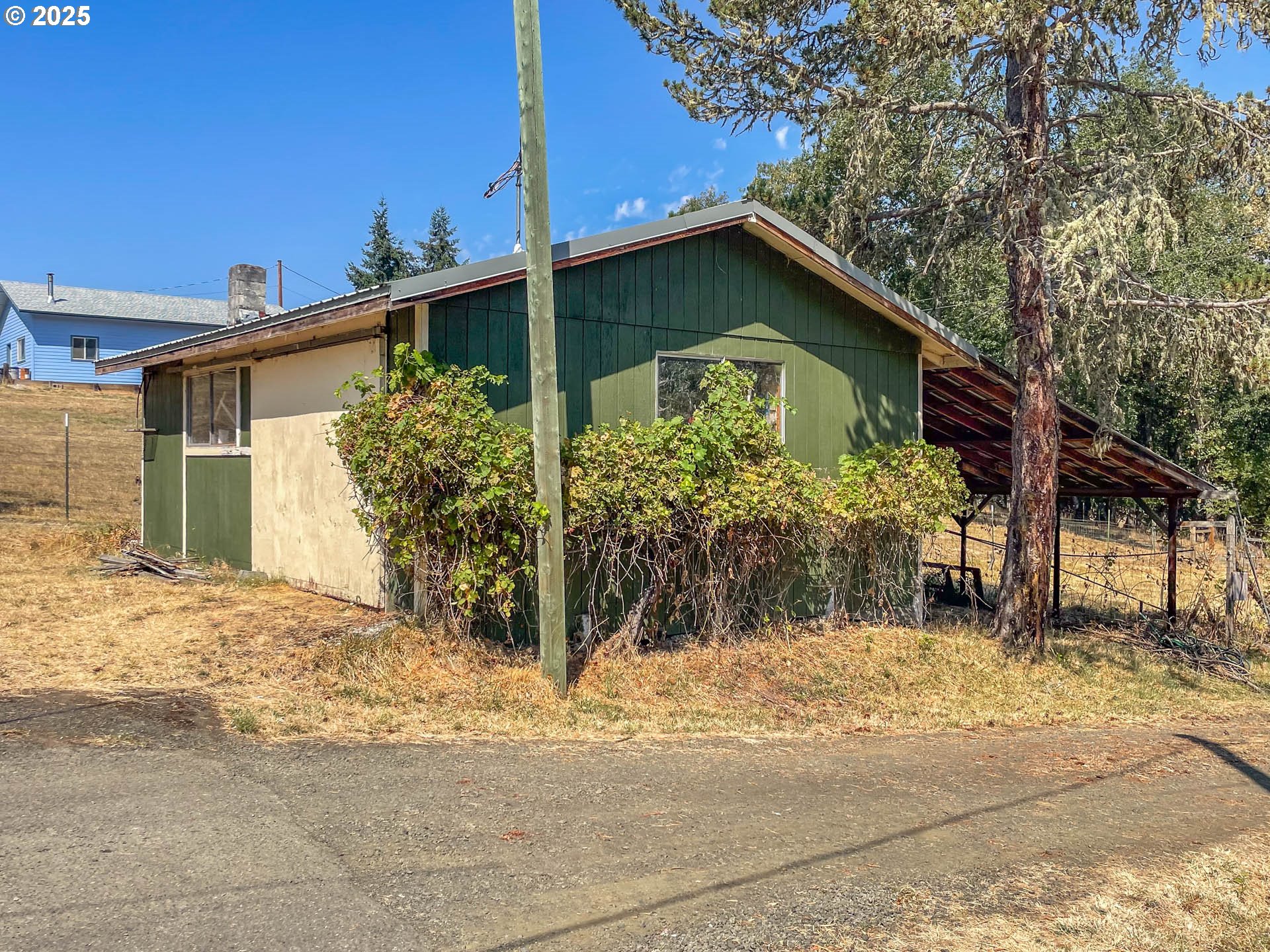 765 O C Brown Road Roseburg, OR 97470 - Photo 45 of 48 a house with a tree in front of it