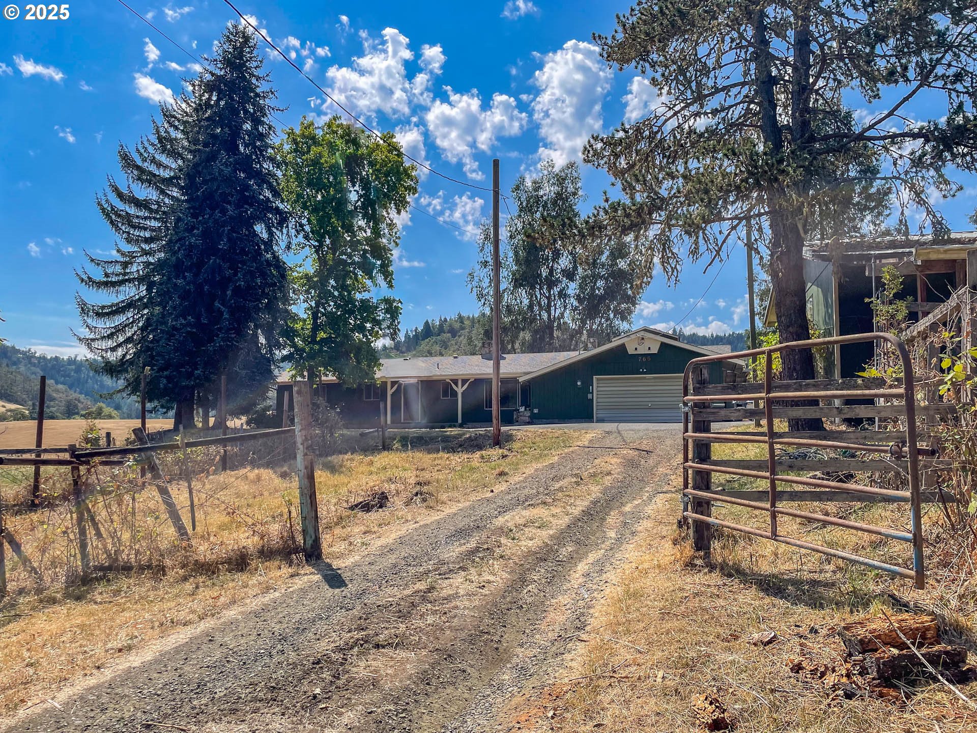 765 O C Brown Road Roseburg, OR 97470 - Photo 48 of 48 a view of a house with a snow on the road