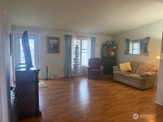 a living room with furniture and a window