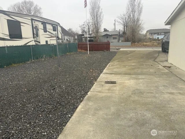 a view of backyard with large trees