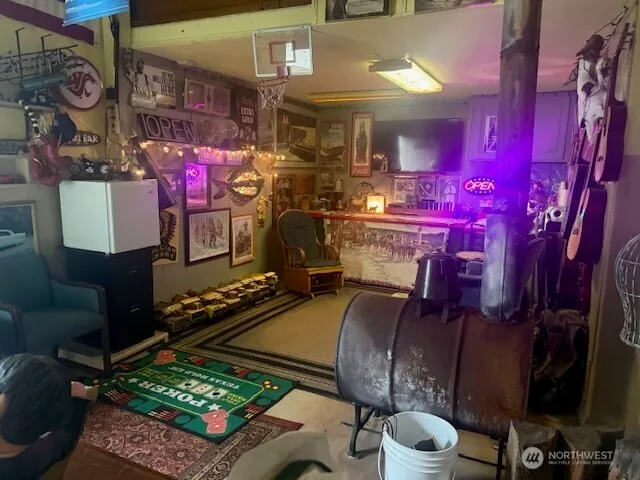 a room filled with lots of different furniture and a table