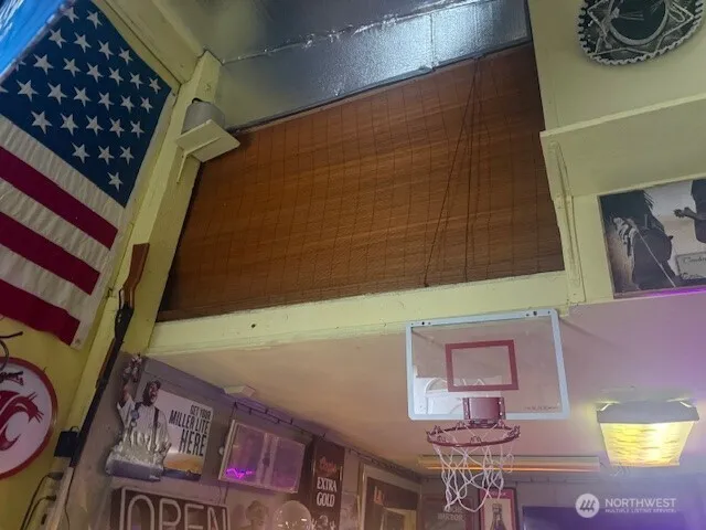 a bathroom with a toilet a sink and a mirror