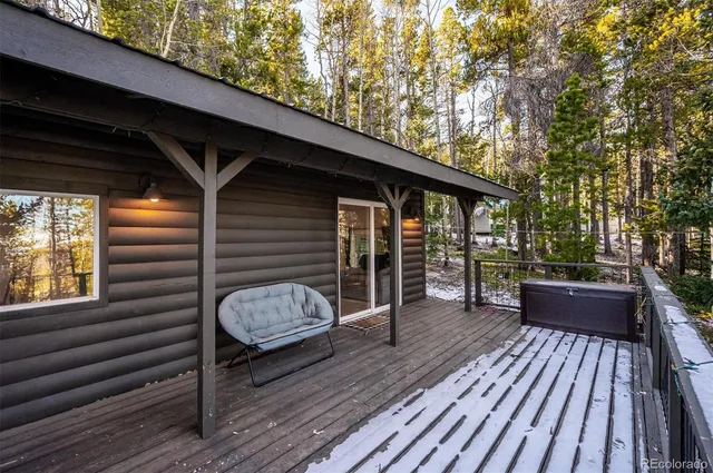 a view of balcony with wooden floor and outdoor seating