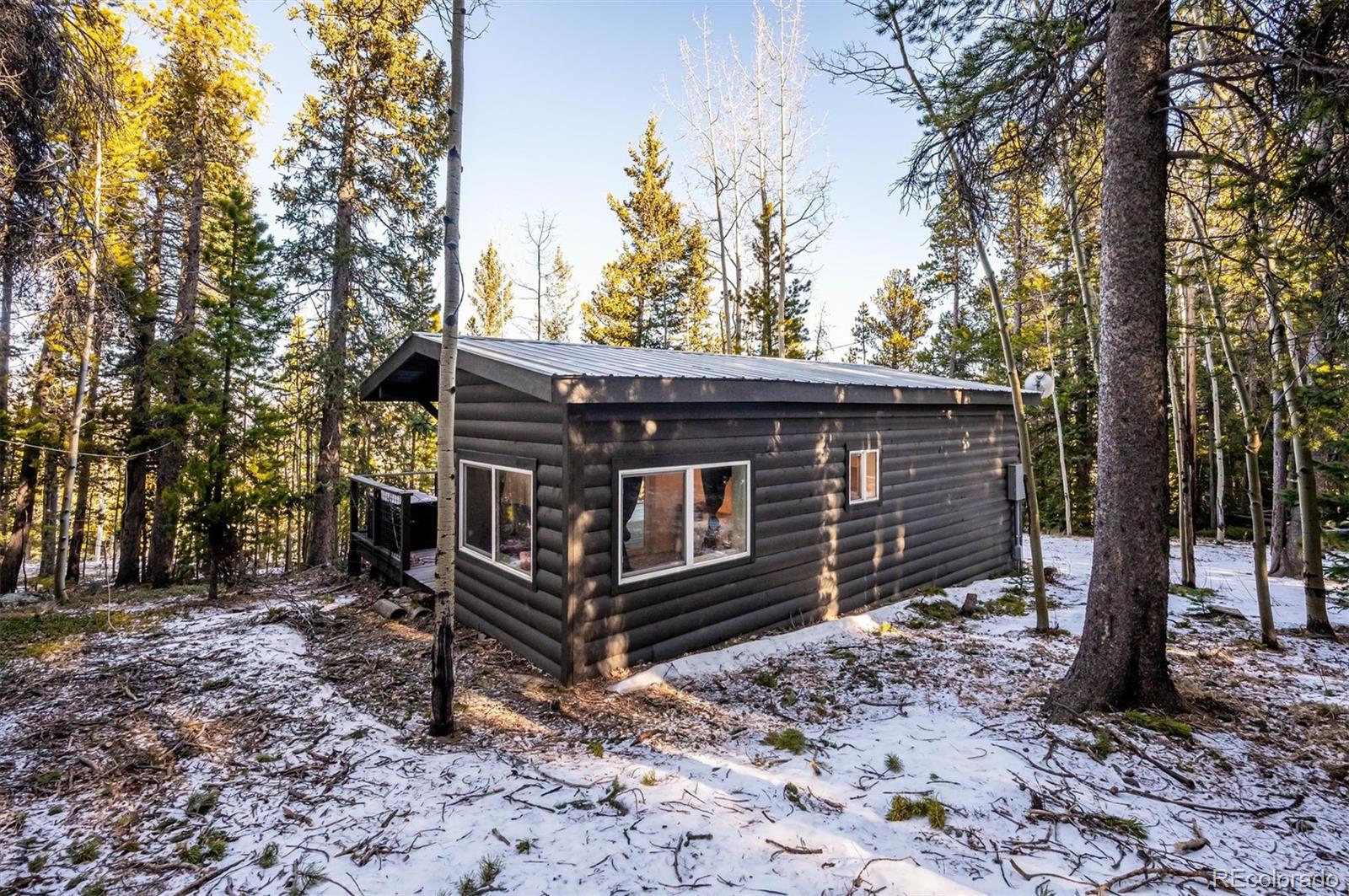2334 Sinton Road Evergreen, CO 80439 - Photo 24 of 28 a view of a house with a yard