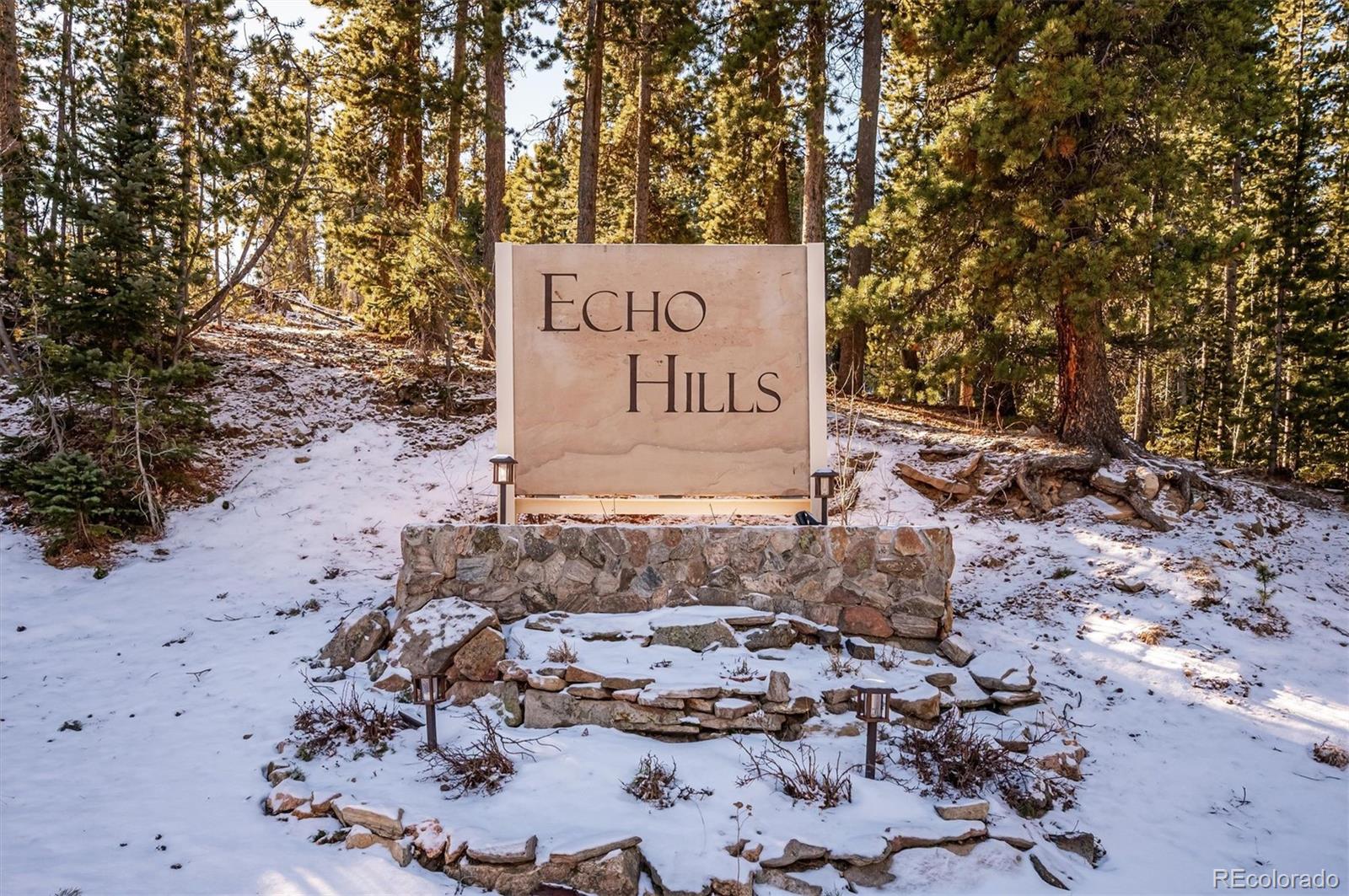 2334 Sinton Road Evergreen, CO 80439 - Photo 27 of 28 a sign that is sitting in the middle of the forest