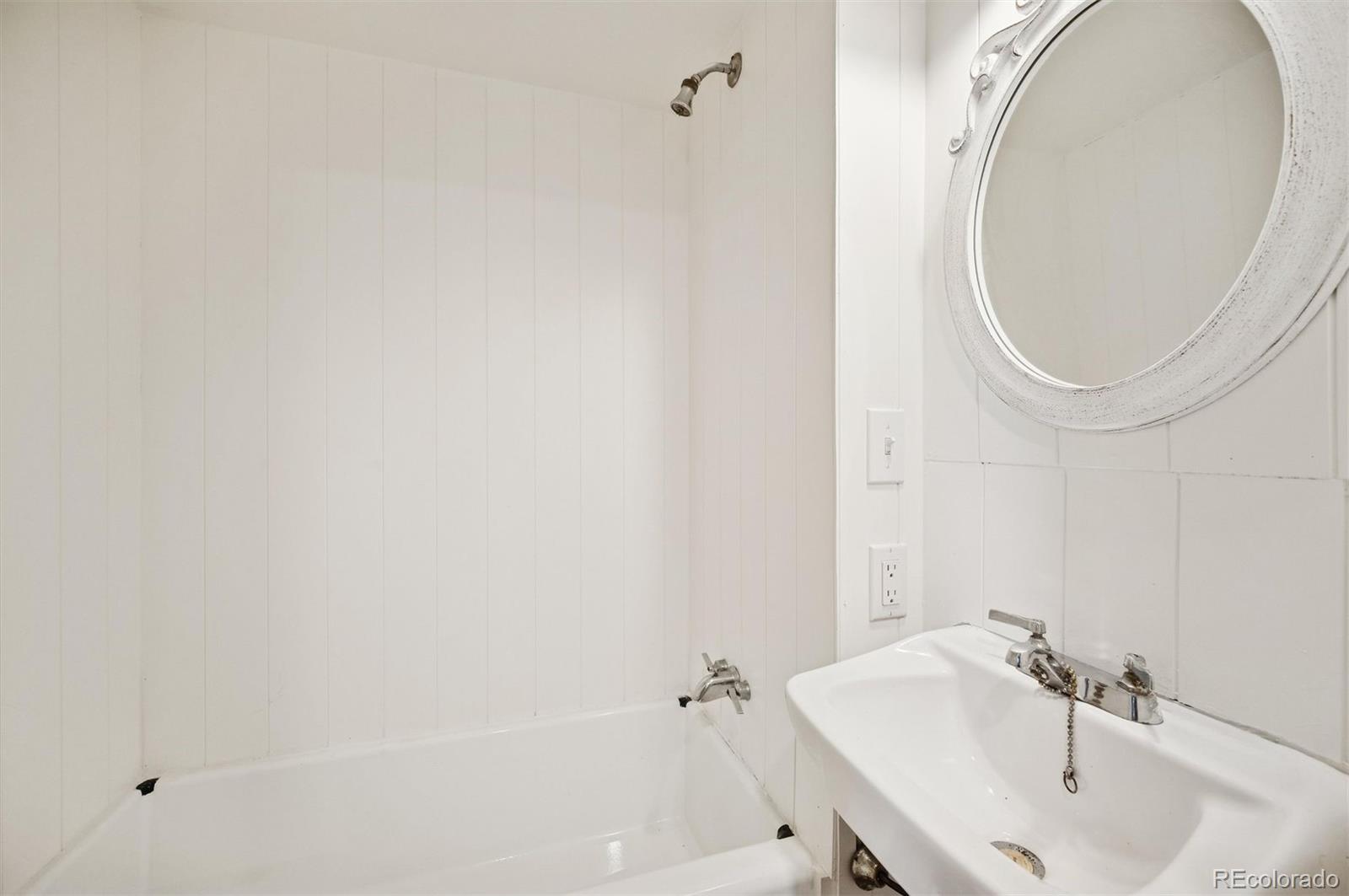 2334 Sinton Road Evergreen, CO 80439 - Photo 9 of 28 a bathroom with a sink and a mirror