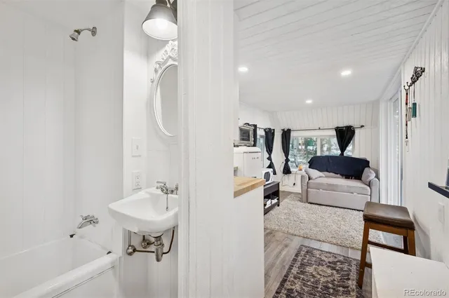 a en suite bathroom with a sink and a mirror