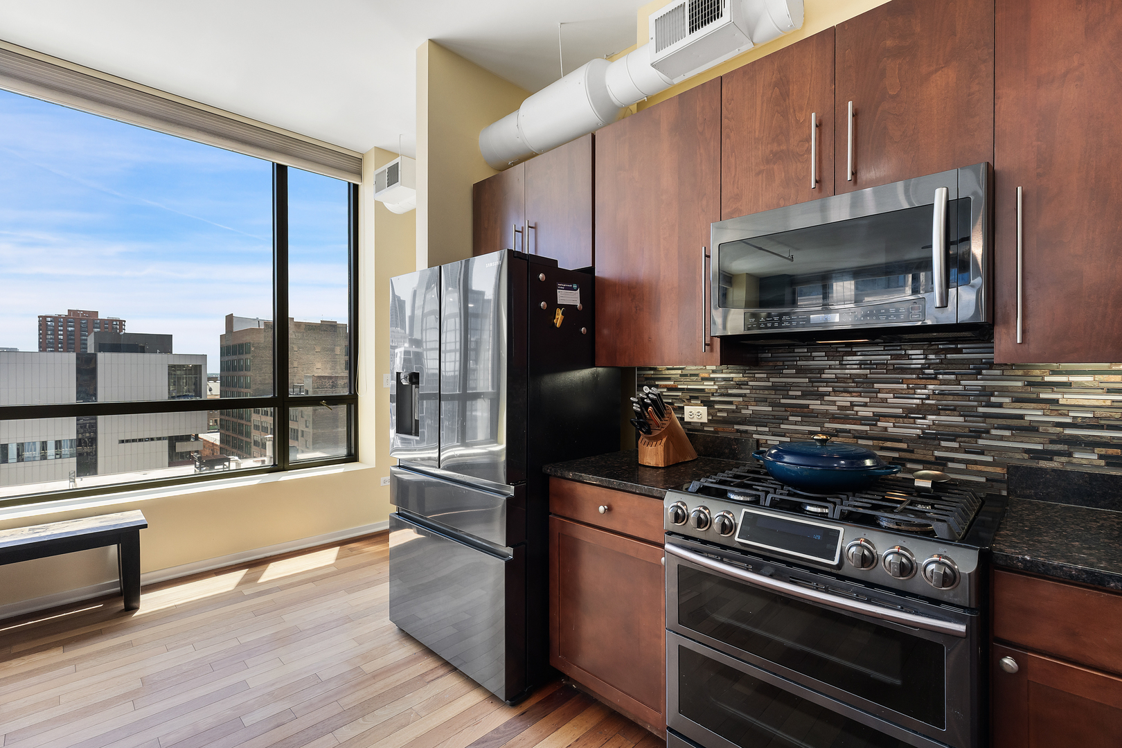 520 South State Street, Unit 1201 Chicago, IL 60605 - Photo 12 of 46 a kitchen with a refrigerator stove and microwave