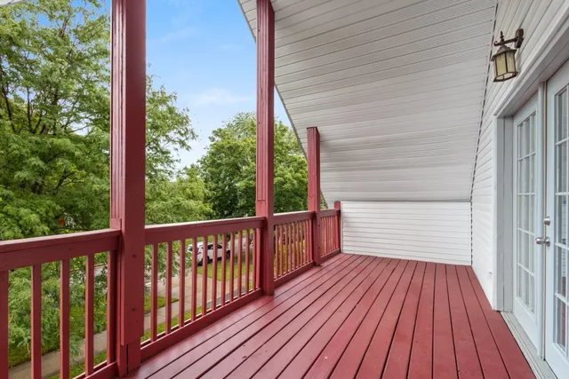 a view of a balcony with wooden floor