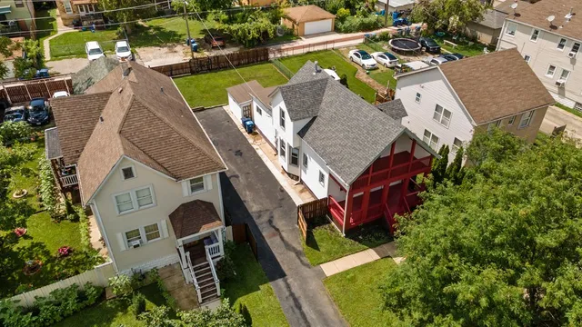an aerial view of residential houses with outdoor space