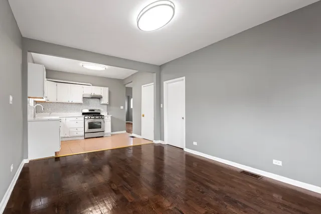 a view of kitchen and wooden floor