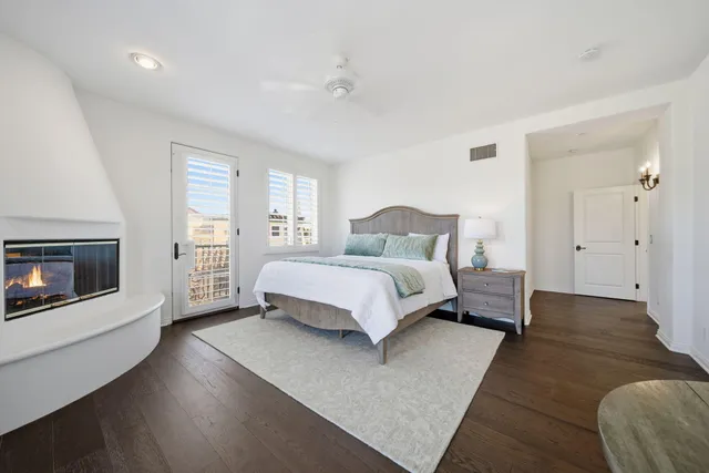 a bedroom with a bed and a fireplace