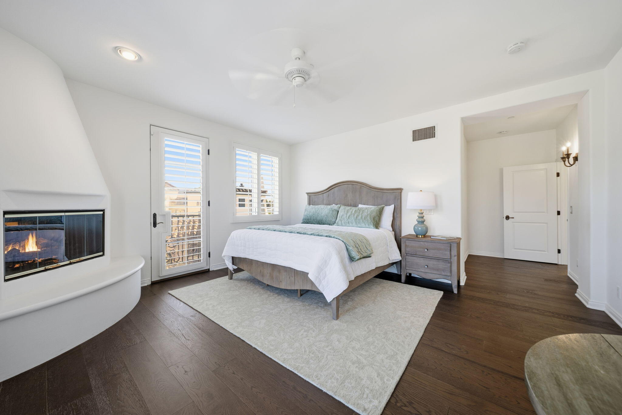 218 Santa Barbara Street, Unit D Santa Barbara, CA 93101 - Photo 11 of 25 a bedroom with a bed and a fireplace