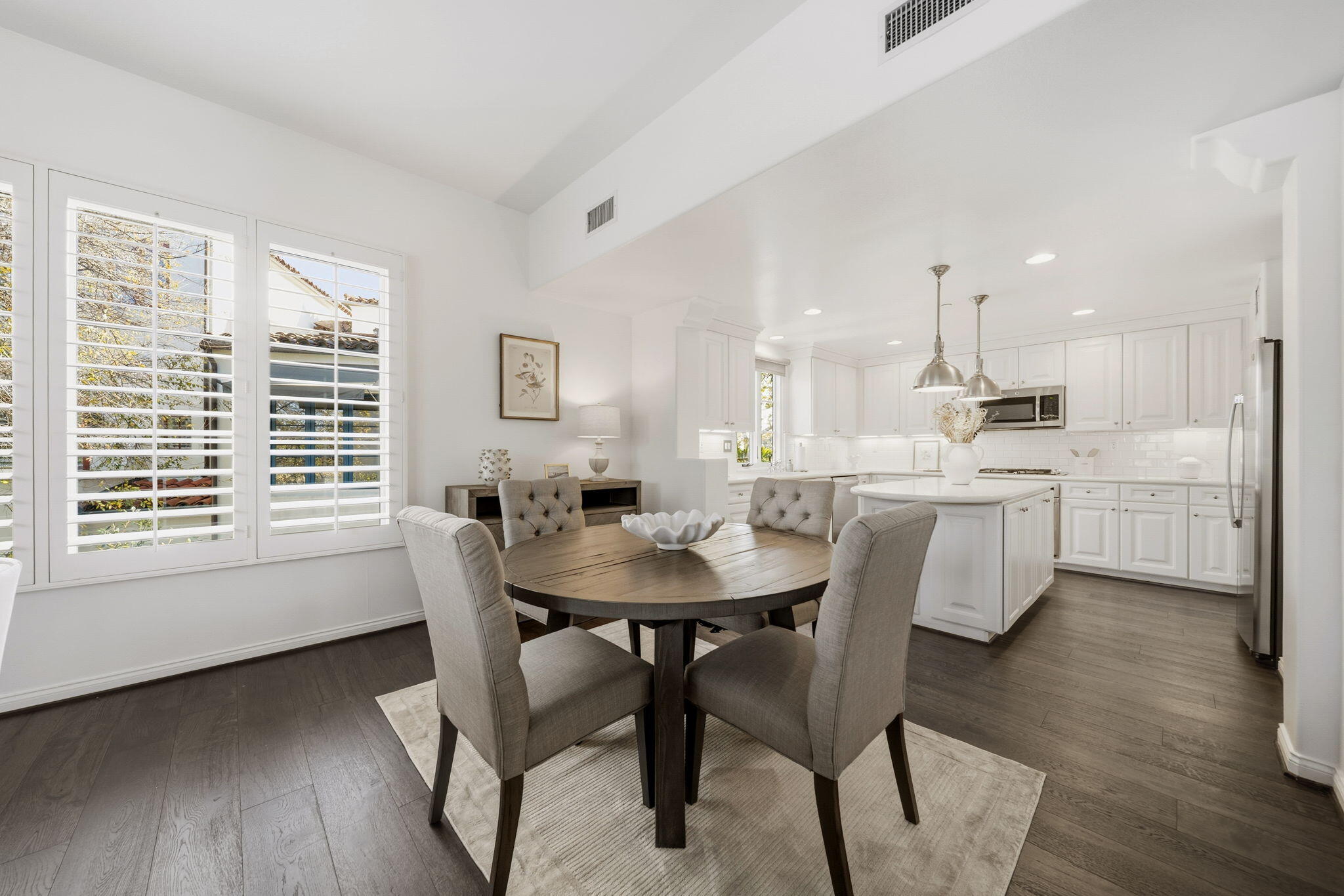 218 Santa Barbara Street, Unit D Santa Barbara, CA 93101 - Photo 13 of 25 a view of a dining room with furniture and wooden floor