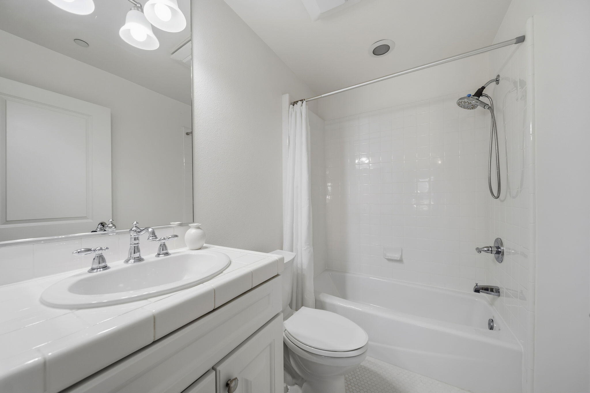 218 Santa Barbara Street, Unit D Santa Barbara, CA 93101 - Photo 17 of 25 a bathroom with a sink toilet and shower