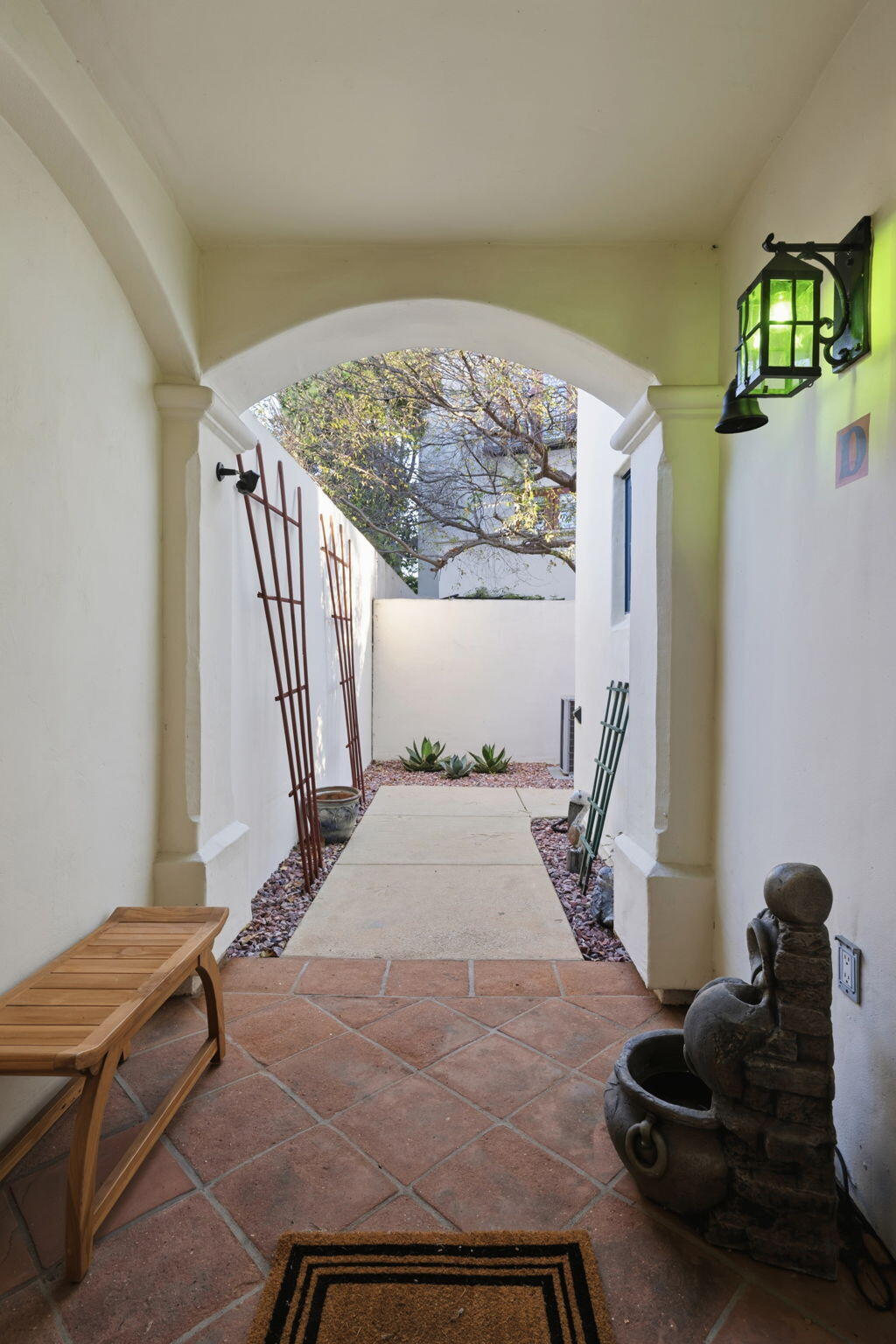 218 Santa Barbara Street, Unit D Santa Barbara, CA 93101 - Photo 5 of 25 a bedroom with a bed and a window