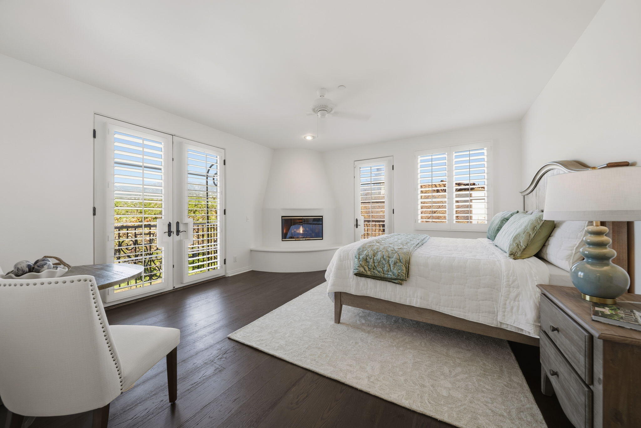 218 Santa Barbara Street, Unit D Santa Barbara, CA 93101 - Photo 10 of 25 a bedroom with a large bed and wooden floor