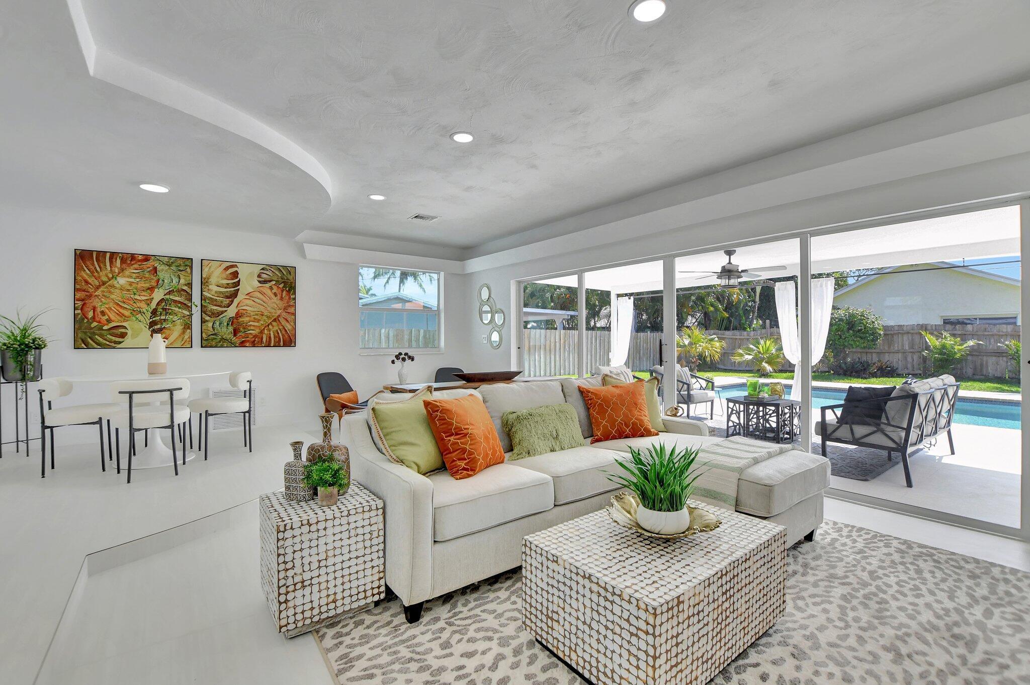 832 Southwest 10th Avenue Boca Raton, FL 33486 - Photo 11 of 57 a living room with furniture and a large window