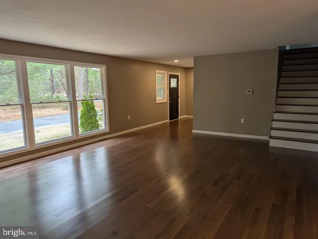 a kitchen with stainless steel appliances a stove a sink a stove and a microwave