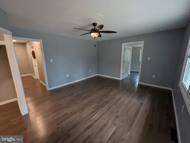 a bathroom with a sink a toilet and shower a mirror