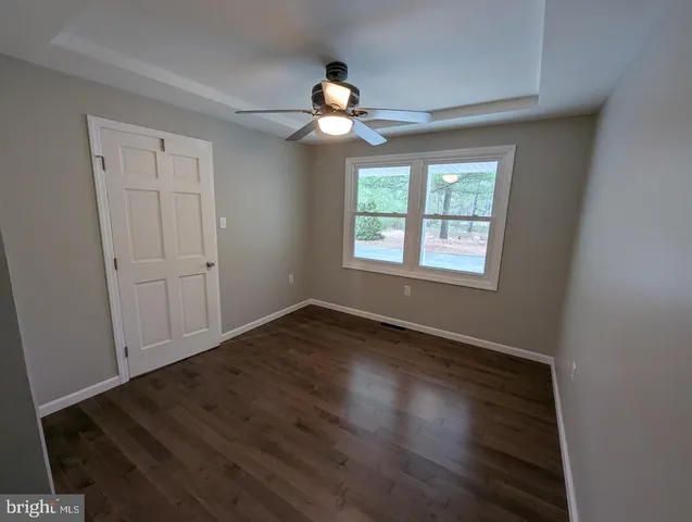 a bathroom with a sink toilet and mirror