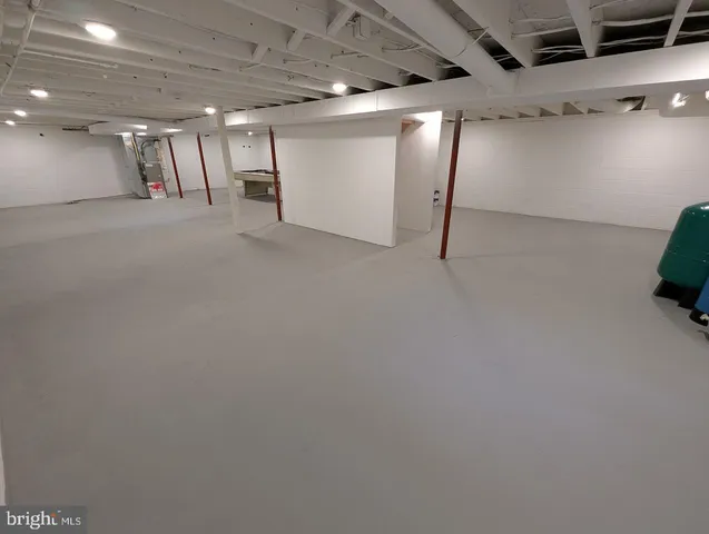 a front view of house with yard and trees around