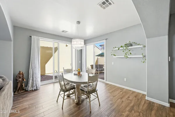 a view of a dining room with furniture and wooden floor