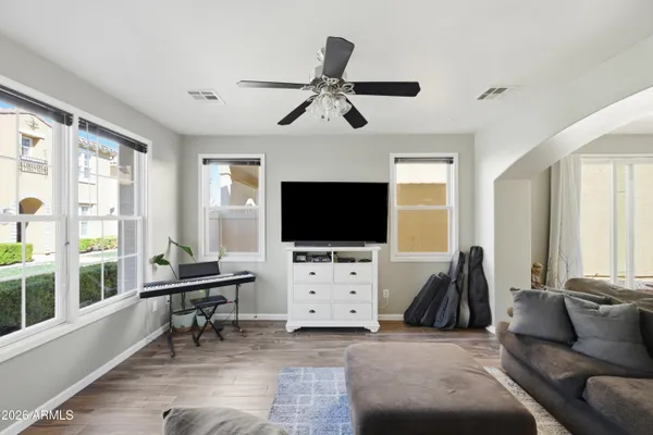 a living room with furniture and a flat screen tv