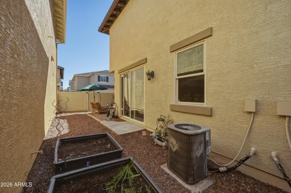 a bathroom with a granite countertop sink a toilet and mirror