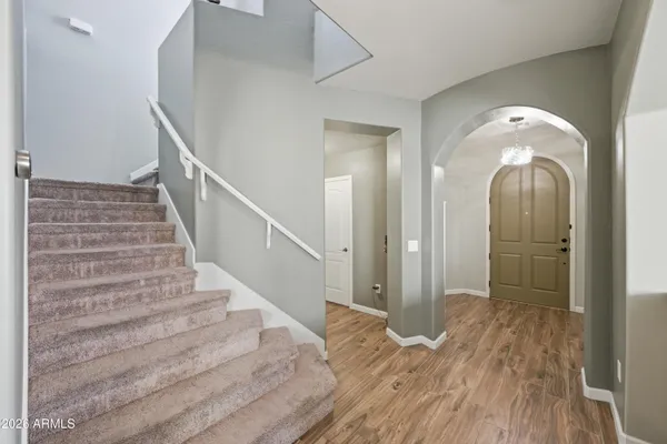 a view of a hallway view with staircase