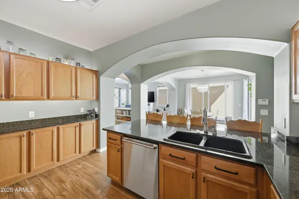 a kitchen with stainless steel appliances a sink and cabinets